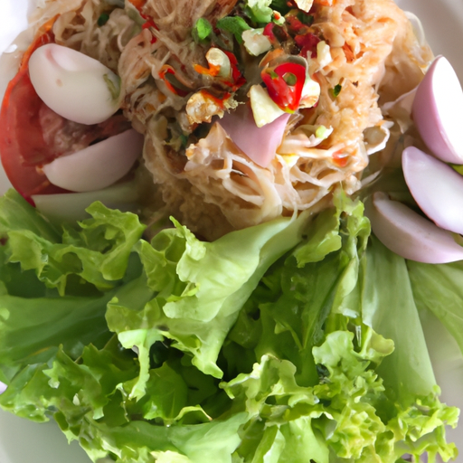 "Spicy Thai Noodle Salad: A Flavorful and Delicious Recipe Packed with Thai Spices and Fresh Vegetables"